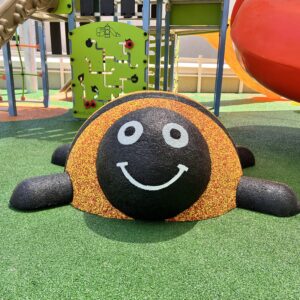 Textured surface of green and black recycled rubber granule safety flooring